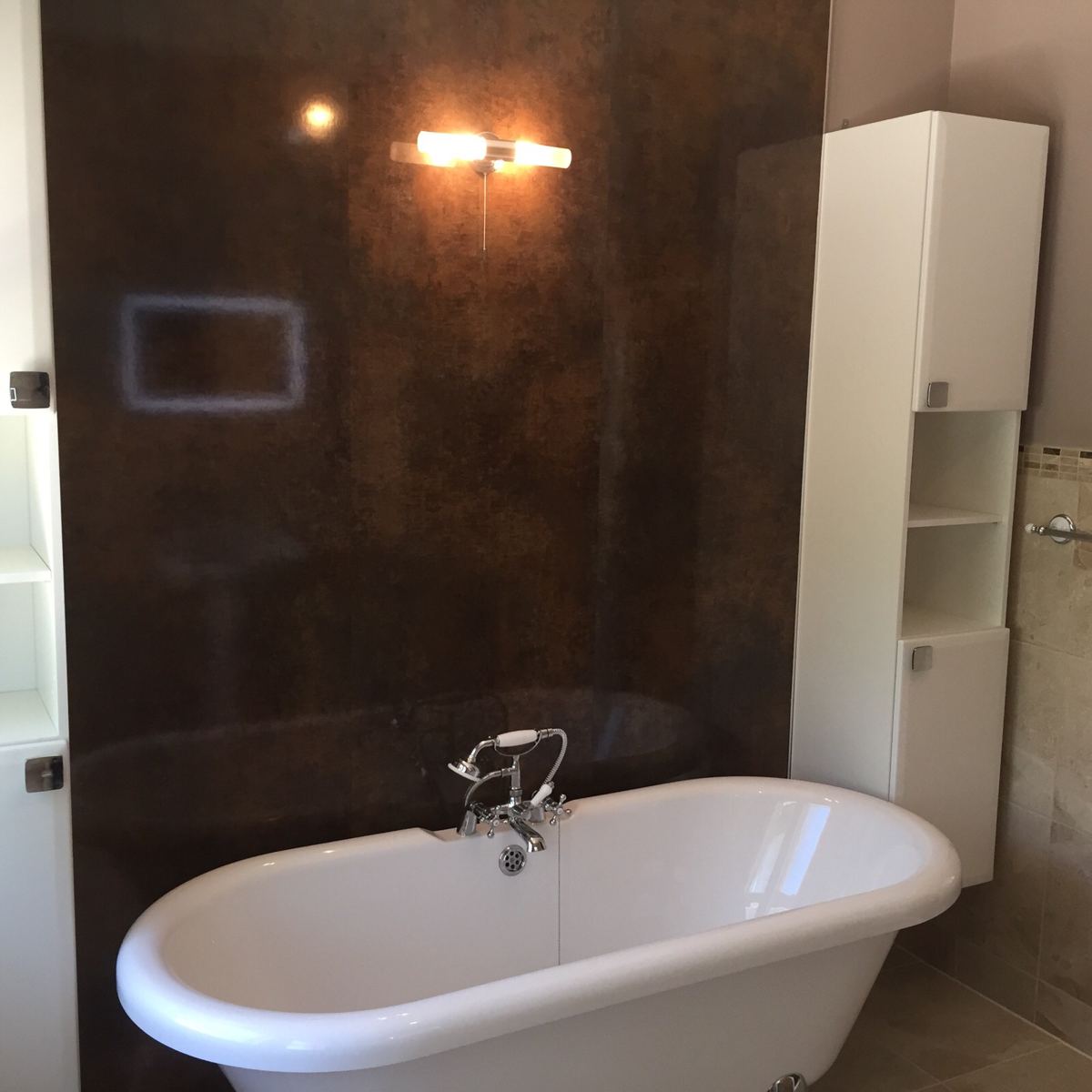 Freestanding roll-top bath fitted by P.D. Powell & Sons