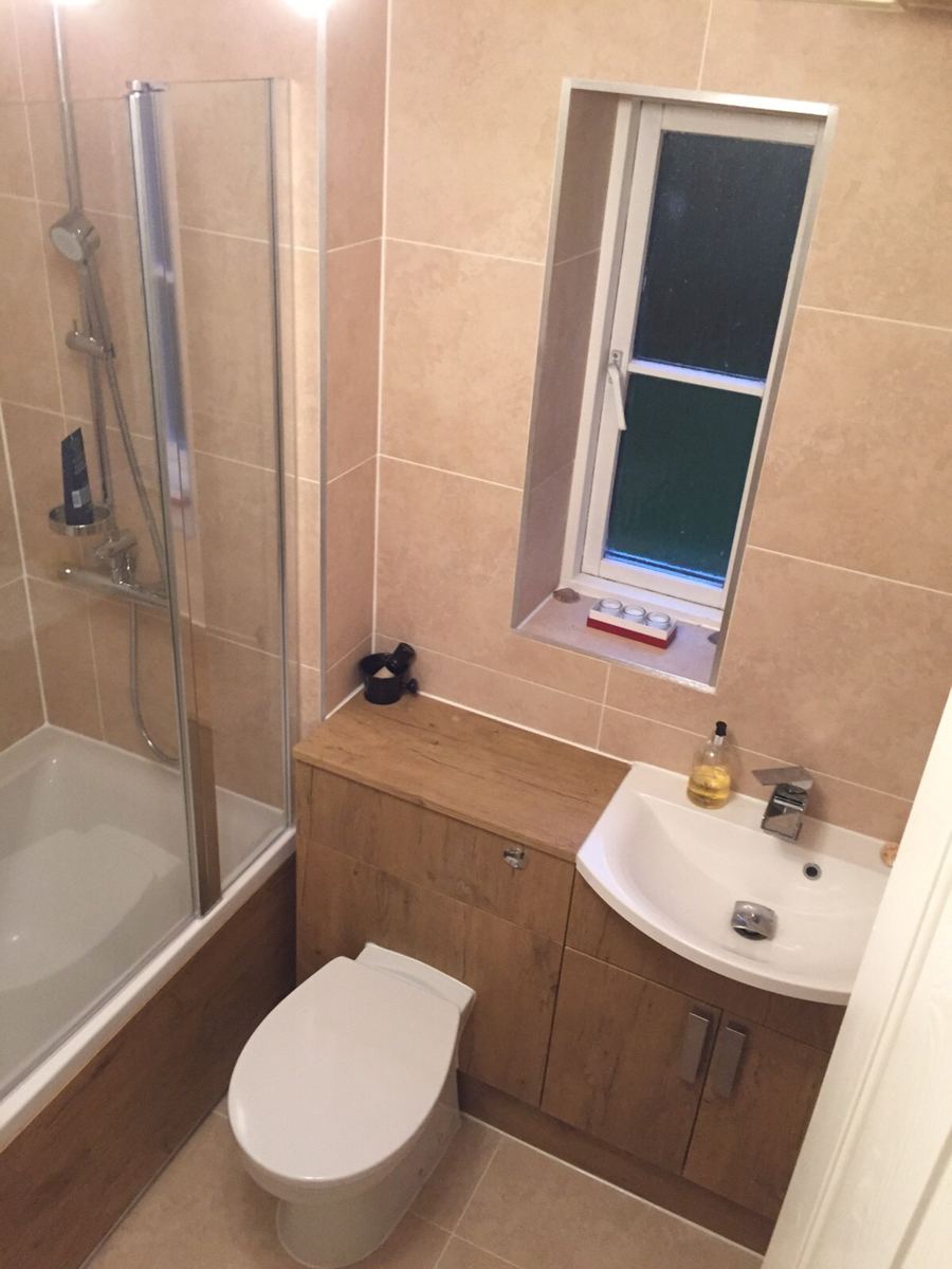 Fitted bathroom with oak-effect furniture